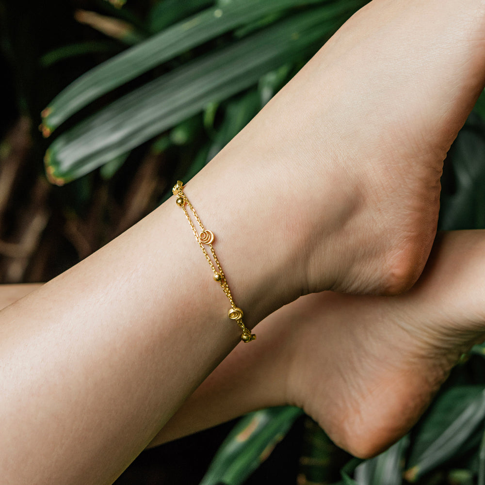 Signature Rose Anklet in 18k gold vermeil worn on the ankle