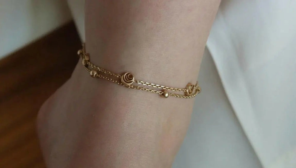 Signature Rose Anklet worn, double chain with rose discs and beads, 18k gold vermeil