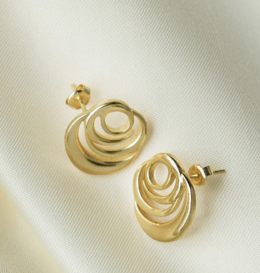 Signature Rose Earrings in 18k gold vermeil, spiral rose studs on silk